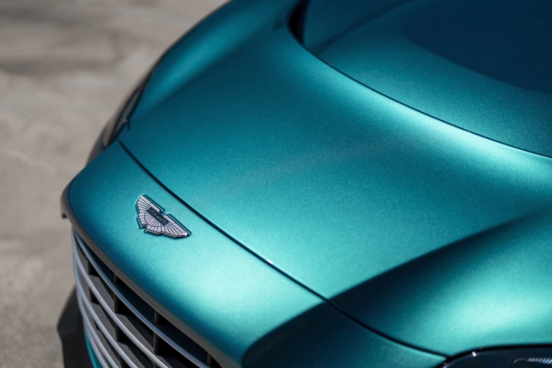 Aston Martin Vanguard nameplate is registered as a trademark.